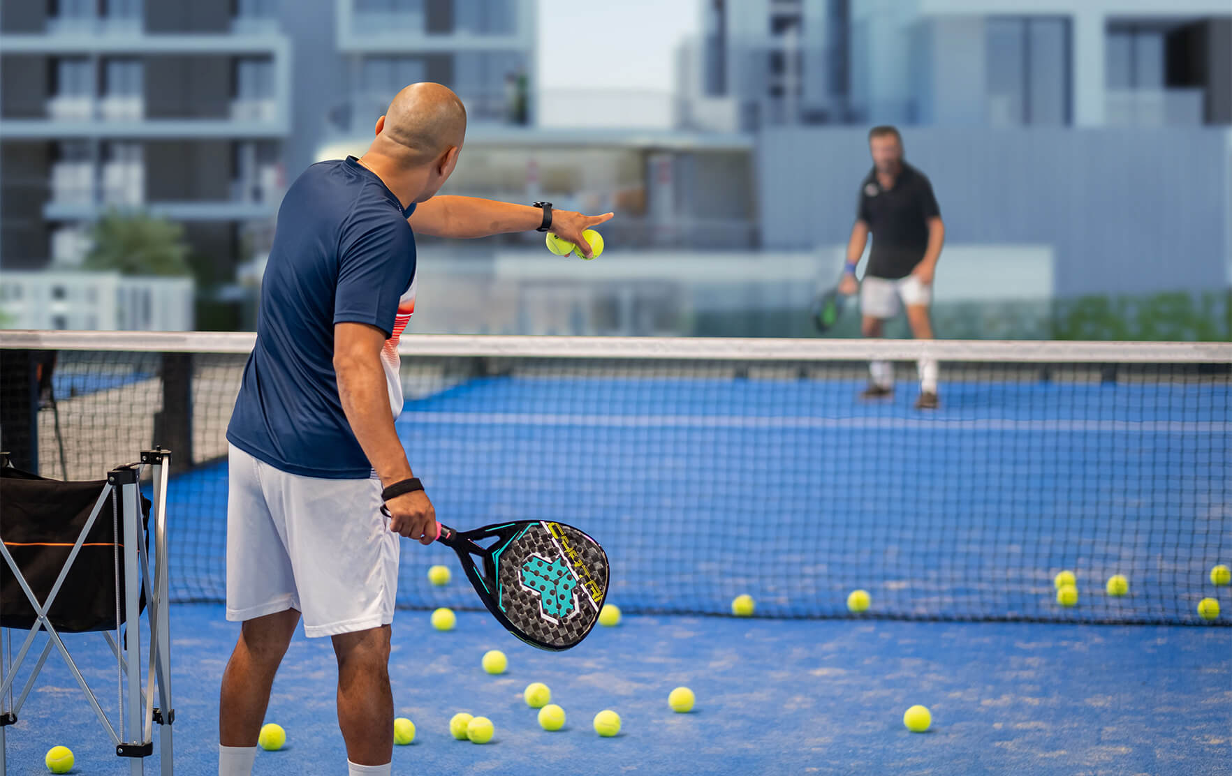 Play padel tennis on professional courts at Torino by Oro24 in Dubai.